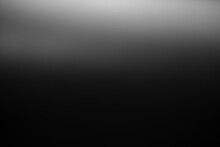 Dark Black And Gray Blurred  Gradient Background Has A Little Abstract Light.