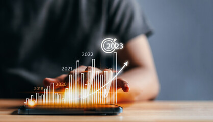 Aufkleber - Businessman analyzes profitability of working company with digital virtual screen graphics. 2023 Planning invest indicators long-term. positive of businessman calculates financial data investments.