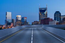 Empty Urban Asphalt Road Exterior With City Buildings Background. New Modern Highway Concrete Construction. Concept Of Way To Success. Transportation Logistic Industry Fast Delivery. Nashville. USA.