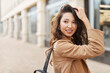 © olga pink - Natural attractive asian kazakh female wearing beige coat, posing on camera