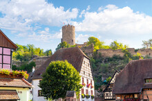 The Medieval Ruins Of The 13th Century Chateau De Kaysersberg Castle Can Be Seen In The Hills Above The Half-timbered Buildings In The Picturesque Town Of Kaysersberg, France, In The Alsace Region.