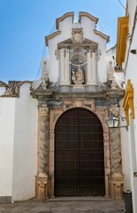 Wall Mural - A facade of a house with a mix of the Mudejar and Christian styles, Cordoba, Spain