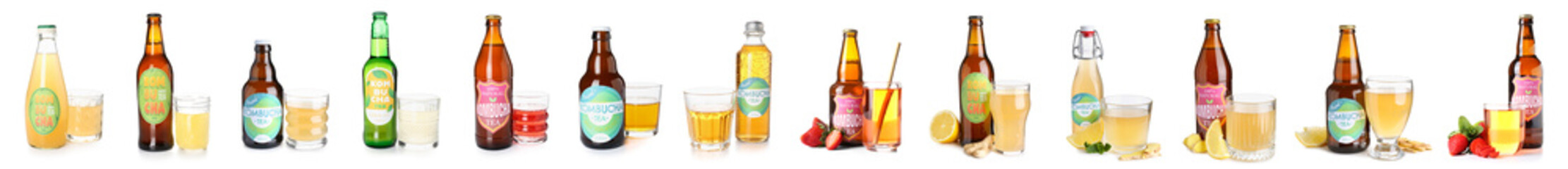  Group of bottles with tasty kombucha drink on white background