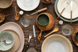 Many different tableware on wooden background, top view