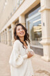 © olga pink - Glamour portrait attractive natural asian kazakh woman wearing white sweater Relaxing outdoor