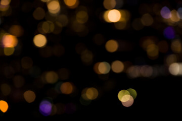 Black and yellow bokeh abstract light background. Artistic style - Defocused urban abstract texture background for your design