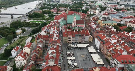 Wall Mural - Aerial view of Old Town in Warsaw, Poland. Flying above roofs and Old Market Square