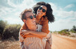 © Kay Abrahams/peopleimages.com - Love, happy and couple piggy back on road path in Arizona desert in USA for romantic getaway. Interracial people dating smile while enjoying summer romance on travel holiday adventure together.