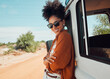 © K Abrahams/peopleimages.com - Travel, freedom and road trip by woman on a break in the countryside, smiling while enjoying the view of Mexico. Summer, van and black woman relax in nature, looking proud on a solo adventure