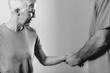 © Microgen - Therapist Checking Senior Woman’s Arm