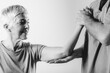 © Microgen - Therapist Checking Senior Woman’s Arm