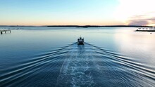 Fishing Boat On Water At Dawn. Fishermen And Lobstermen Catch Fish In Morning Light. Aerial View.