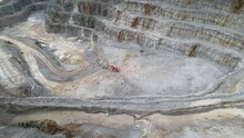 Aerial View Of Limestone Quarry Site With Wheel Loader Near The Coldstones Cut In North Yorkshire, UK. Sideways