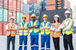 © Kawee - Portrait group of attractive worker people work in container terminal.