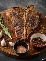 Wall Mural - Juicy porterhouse steak grilled with pepper and salt. T-bone steak.