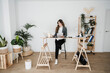 © Westend61 - Young female engineer working in modern office sitting at desk
