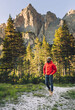 © Westend61 - Hiker walking in front of Dolomites, Italy