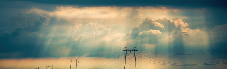 global energy crisis concept, transmission tower electricity pylons with overhead power line cables 