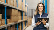 © Jacob Lund - Female warehouse manager smiling at the camera while holding a digital tablet
