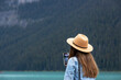 © Kobus - A lovely long hair lady takes pictures of Lake Louise