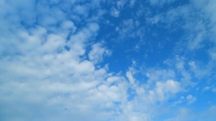 Wall Mural - Nature weather blue sky. White clouds with blue sky background. Tropical summer sunny and sunshine day. Time lapse.