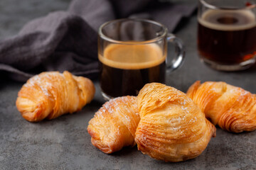 Canvas Print - Italian breakfast with coffee. Caffè Espresso and neapolitan shell-shaped pastry sfogliatelle riccia stuffed with ricotta, almond paste and candied peel of citron. Or lobster tail. Grey background.