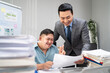 canvas print picture - Asian young businessman with down syndrome working in office workplace. 