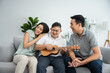 © Kawee - Asian attractive family playing with down syndrome son in living room.