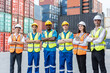 © Kawee - Portrait group of attractive worker people work in container terminal.