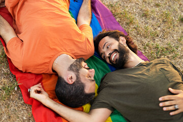 Wall Mural - Happy couple with a pride flag. LGBT community...