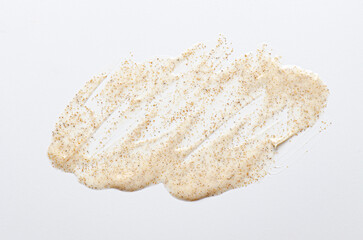 Sample cream scrub for washing with vitamin F. An exfoliating skin care product. White background