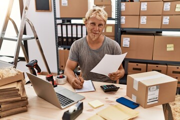 Wall Mural - Young caucasian man smiling confident working at warehouse