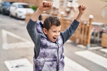 Wall Mural - Blond child smiling confident standing at street