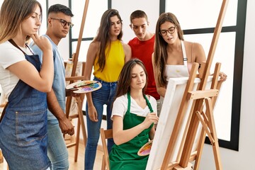 Wall Mural - Group of people with serious expression looking draw of partner at art studio.