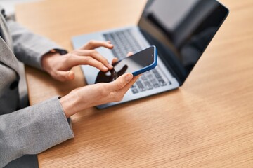 Sticker - Young caucasian woman using laptop and smartphone at office