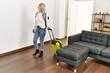 © Krakenimages.com - Middle age grey-haired woman tourist wearing backpack walking with suitcase at home
