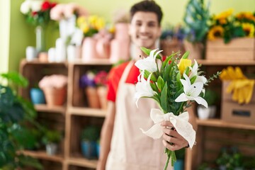 Sticker - Young hispanic man florist holding bouquet of flowers at flower shop