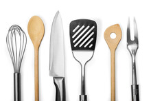 Set of modern steel kitchen utensils on wooden table