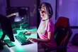 © Krakenimages.com - Young blonde woman streamer smiling confident using computer at gaming room