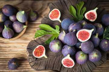 Wall Mural - Fresh ripe figs on the wooden table