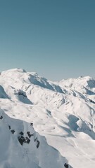 Poster - Vertical breathtaking aerial view of the snowy mountain in the highlands