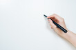 © tickcharoen04 - work and learn online in new normal concept from black pen in woman hand write to white isolated background