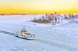 View of the icy harbor at sunset in winter in Helsinki, Finland.