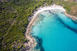 © AmazingAerialAgency - Aerial view of a little bay along the coast in Corse, France.