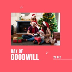 Canvas Print - Composition of day of goodwill text over biracial couple with children in santa hats at christmas