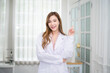 © Suriyo - Asian woman doctor in hospital concept, Asian woman doctor  standing  in hospital , Asian woman doctor in hospital  design for hospital website banner