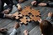 © alotofpeople - Business people team with puzzle