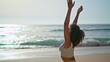 © stockbusters - Yogi girl standing sand near ocean waves making Namaste hands. Woman meditating.
