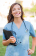 © Andy Dean - Young Adult Woman Doctor or Nurse Holding Touch Pad Outside