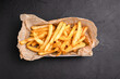 French fries, French fries for beer on a black background